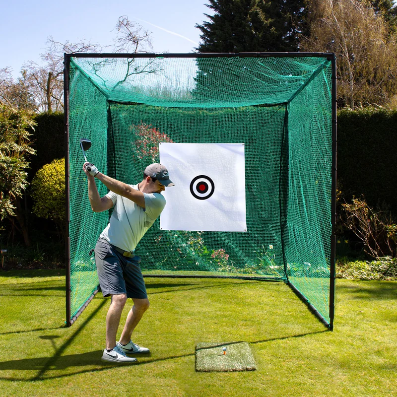 Golfer mid-swing in a garden golf cage and net with archery-grade impact panel