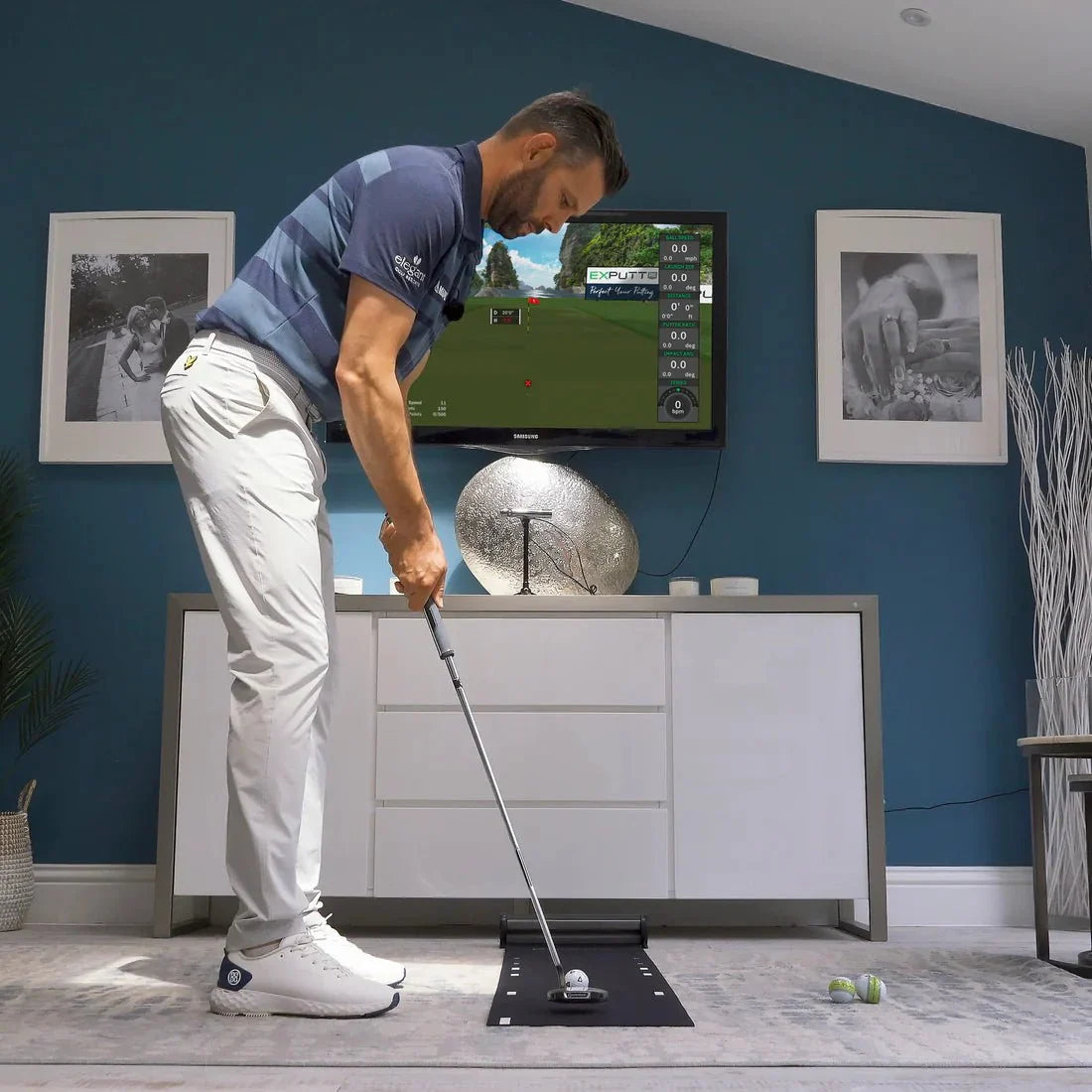 Exputt RG Golf Putting Simulator — man using ExPutt putting simulator indoors