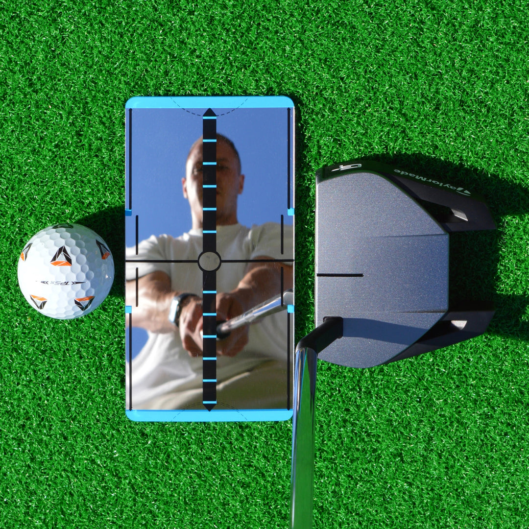 Golf alignment mirror paired with golf net and mat for home drills