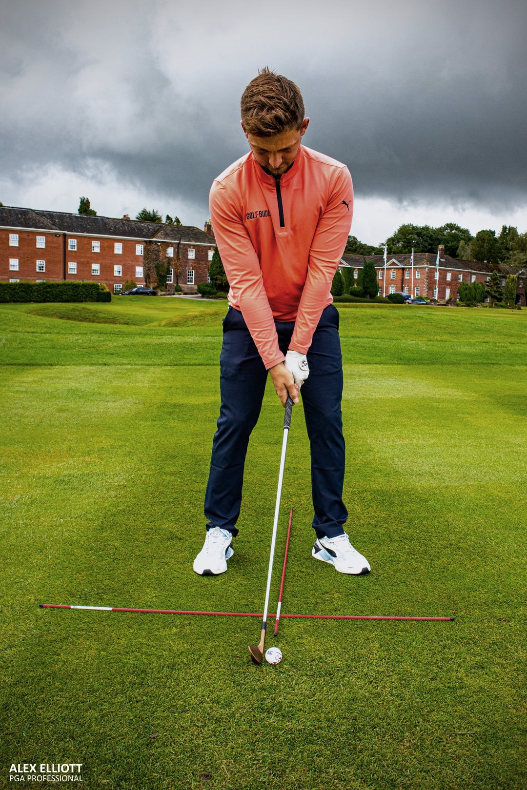 Alignment sticks used with golf net and mat for stance correction drills