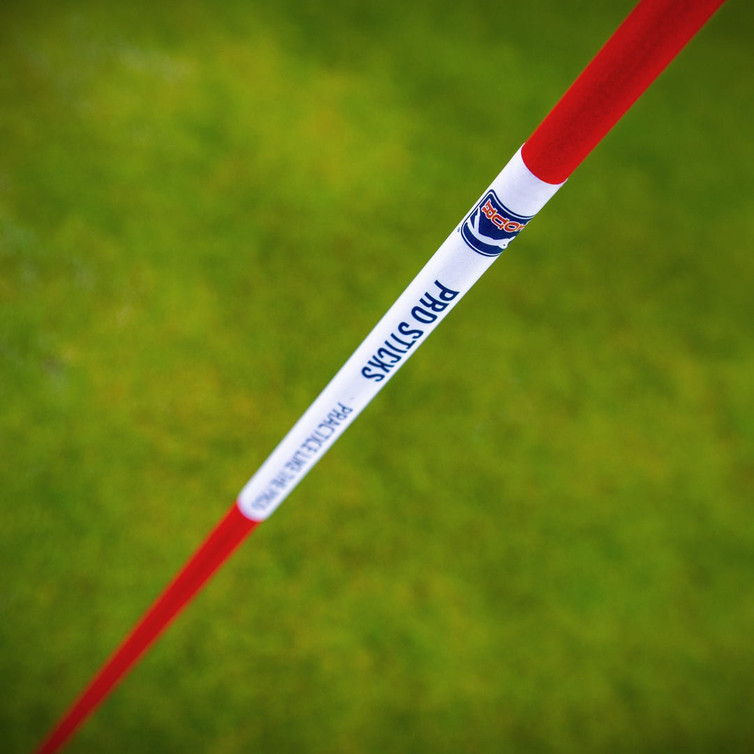 PGA TOUR Pro Sticks shown against durable golf netting for practice
