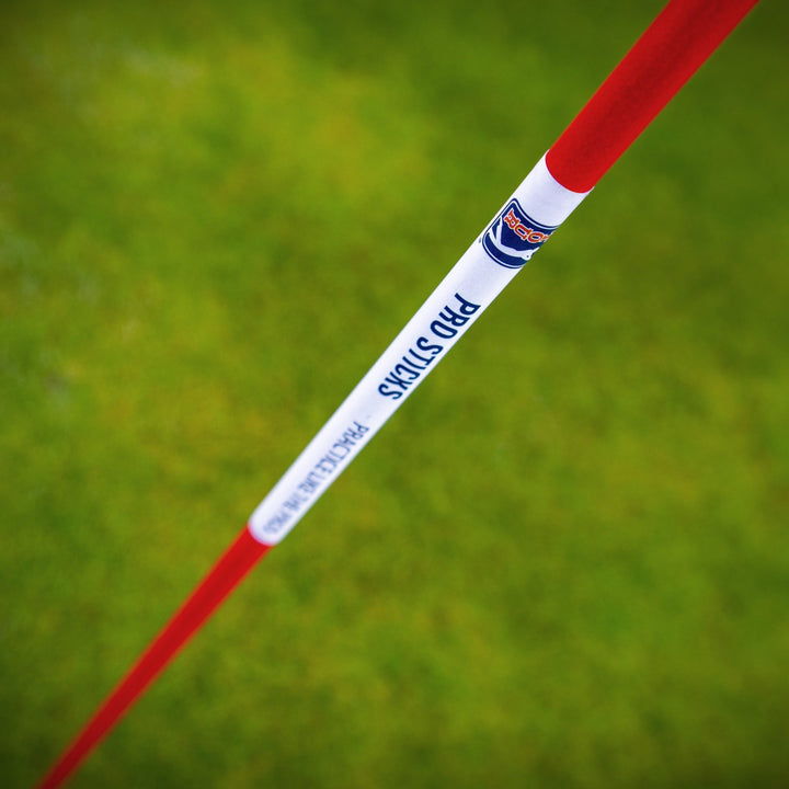 PGA TOUR Pro Sticks shown against durable golf netting for practice