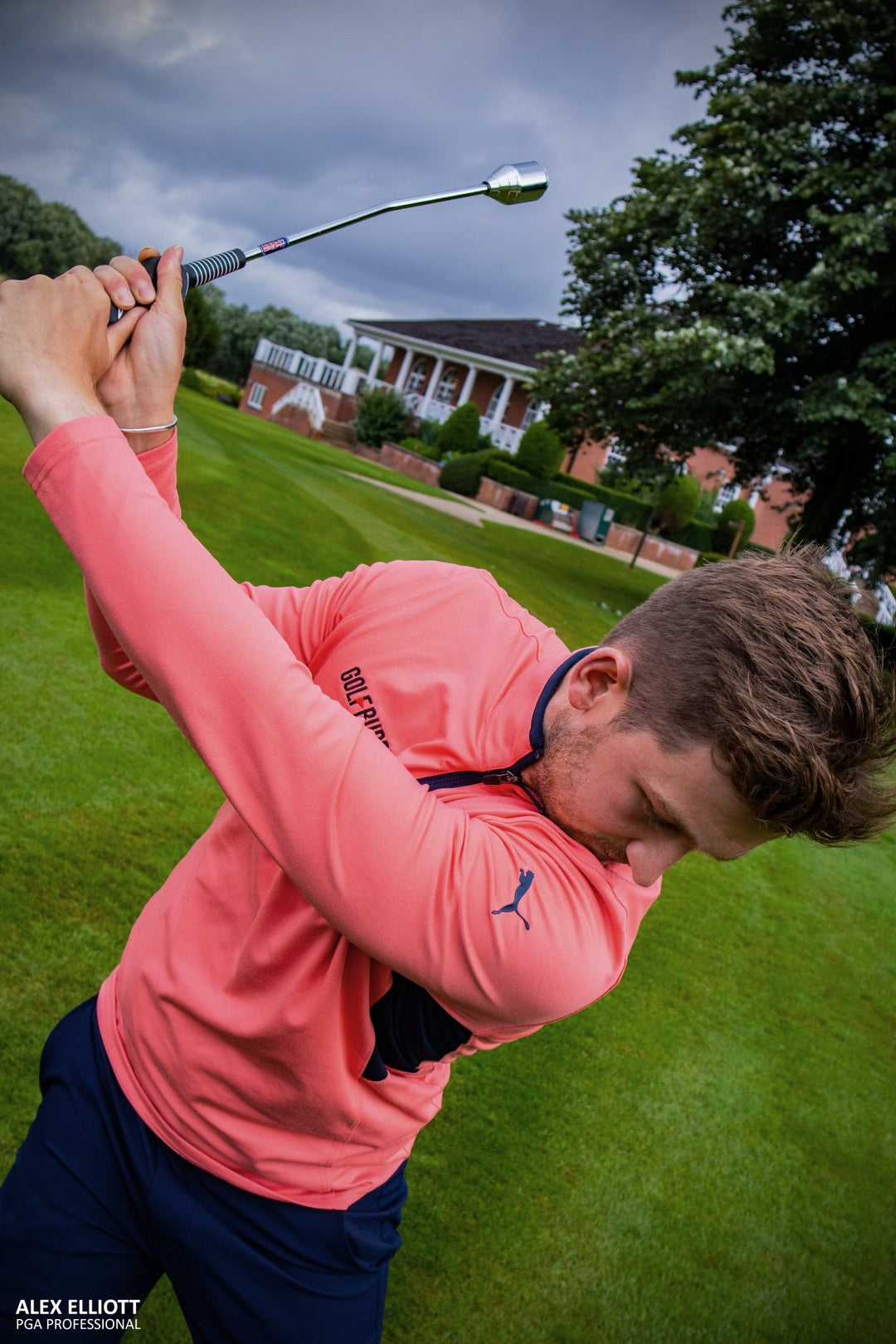 Close-up of PGA TOUR Swing Weight Club with durable golf netting background