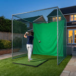 Illustration: Pro golf cage on artificial turf beside a patio at blue hour, golfer with a driver