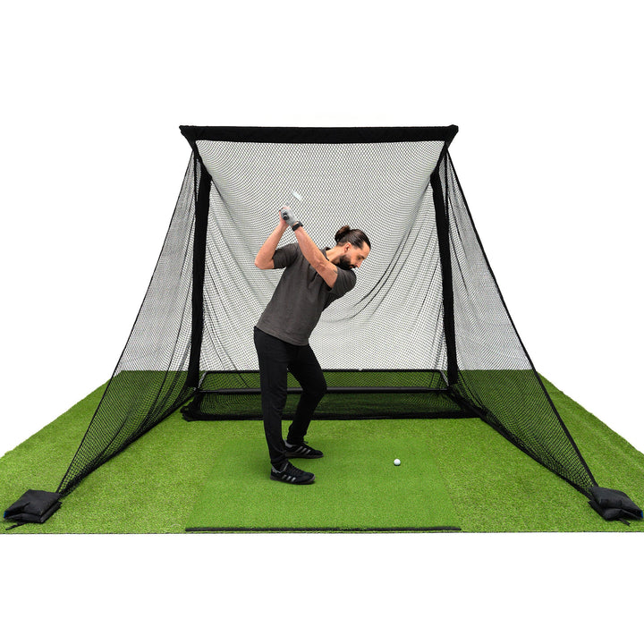 Golfer hitting a ball in the SimSpace Deluxe large Golf Practice Net 